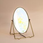 Goudkleurig tafelspiegeltje op standaard vintage