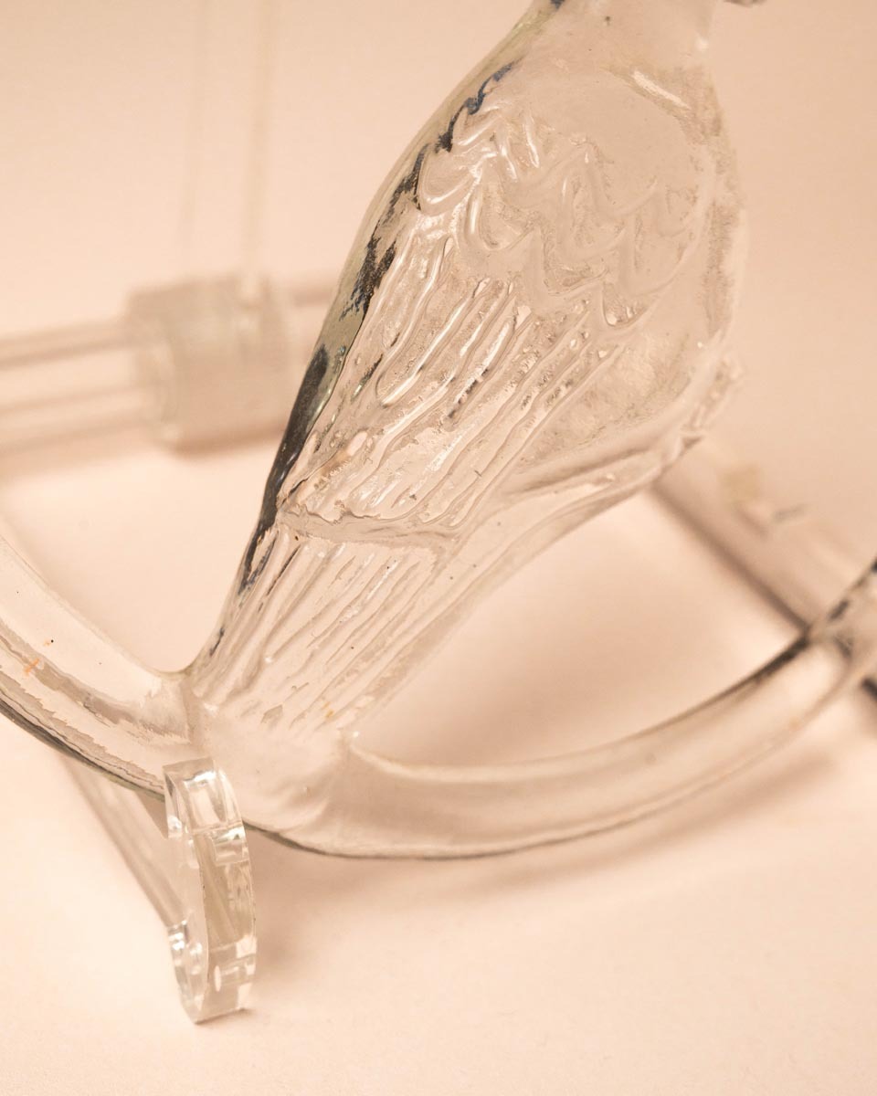 Glazen zonnehanger in ringvorm met duif